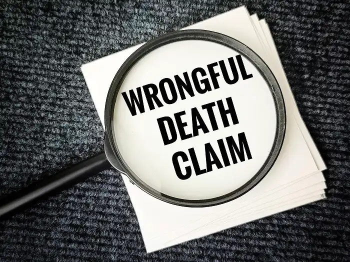 Magnifying glass over a note reading Wrongful Death Claim